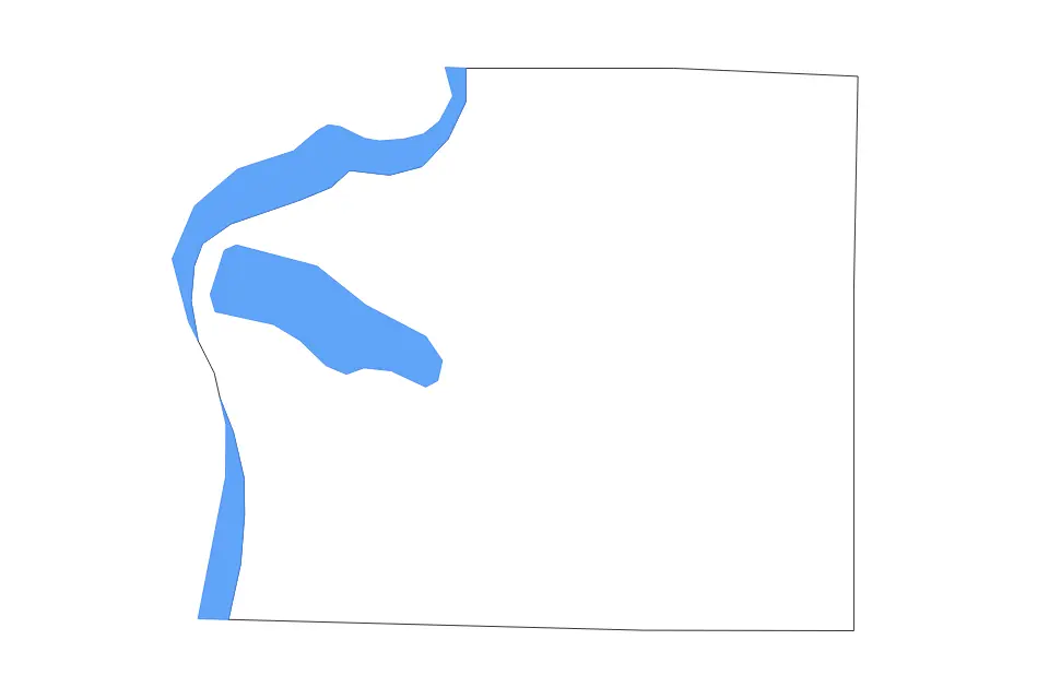 Outline map of Benzie County, Michigan with subdivision borders and major lakes.
